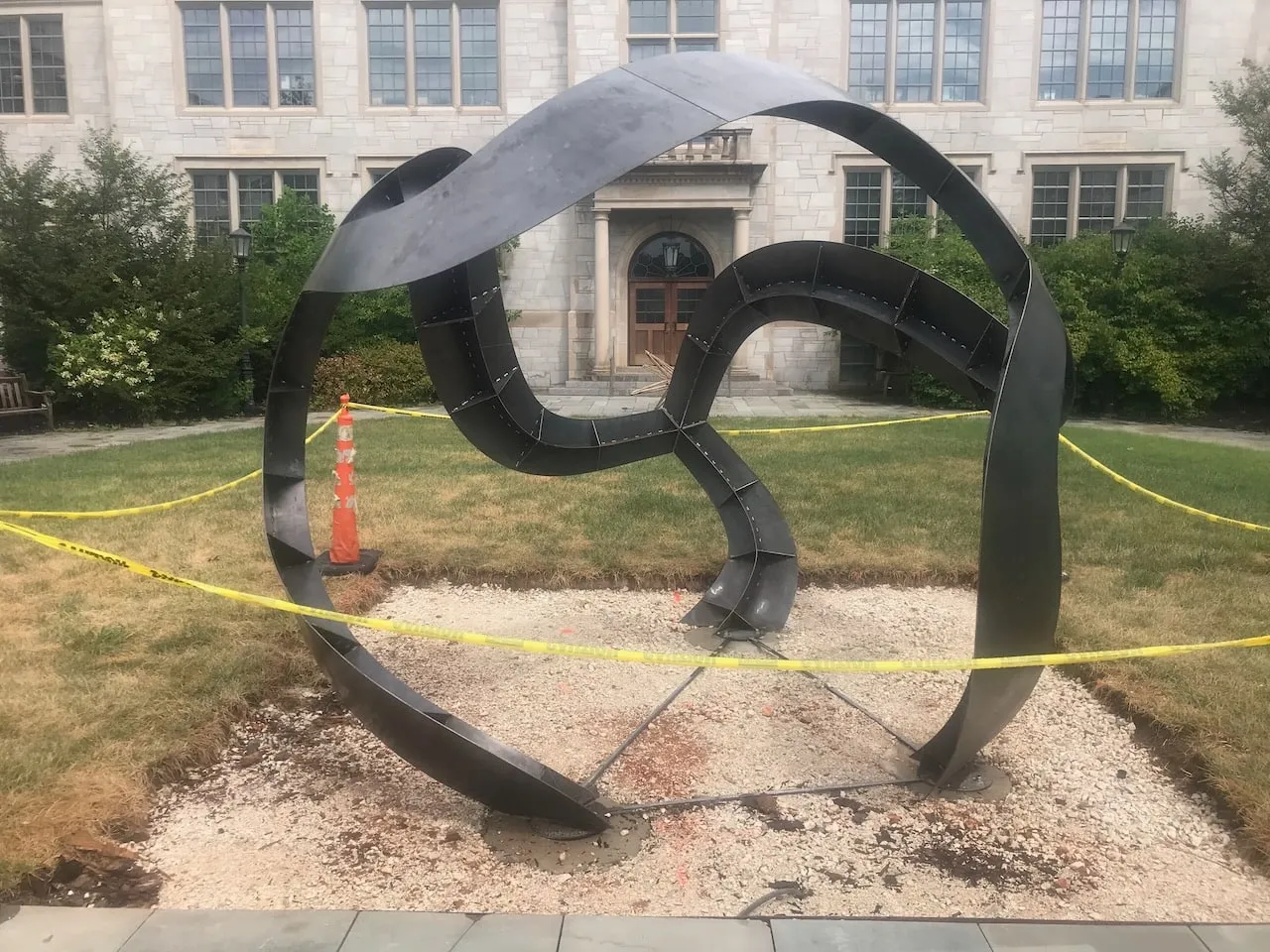 The sculpture just placed in front of Gearhart Hall, yellow caution tape still up and gravel base not yet finished