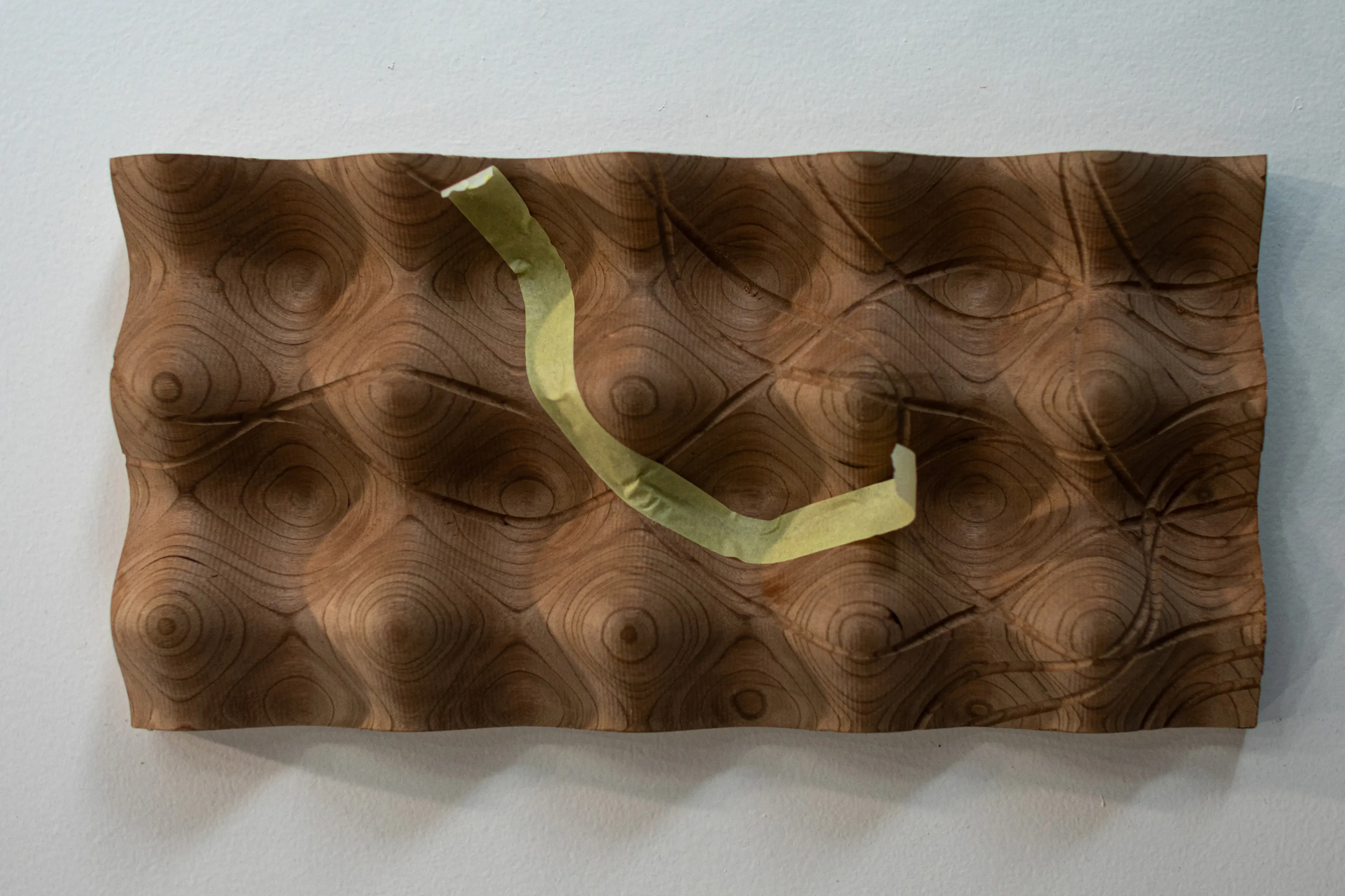 Geodesic board showing a geodesic revealed with tape.