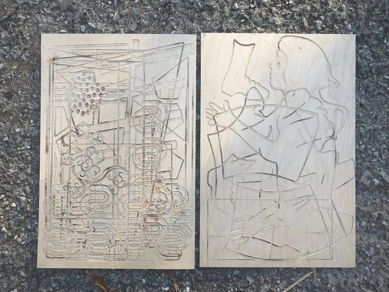 The backing boards for CNC-carving showing all that had been cut, formulas, gears, a bookcase, musical notation, and a large dancing figure with flowing hair carved in low relief