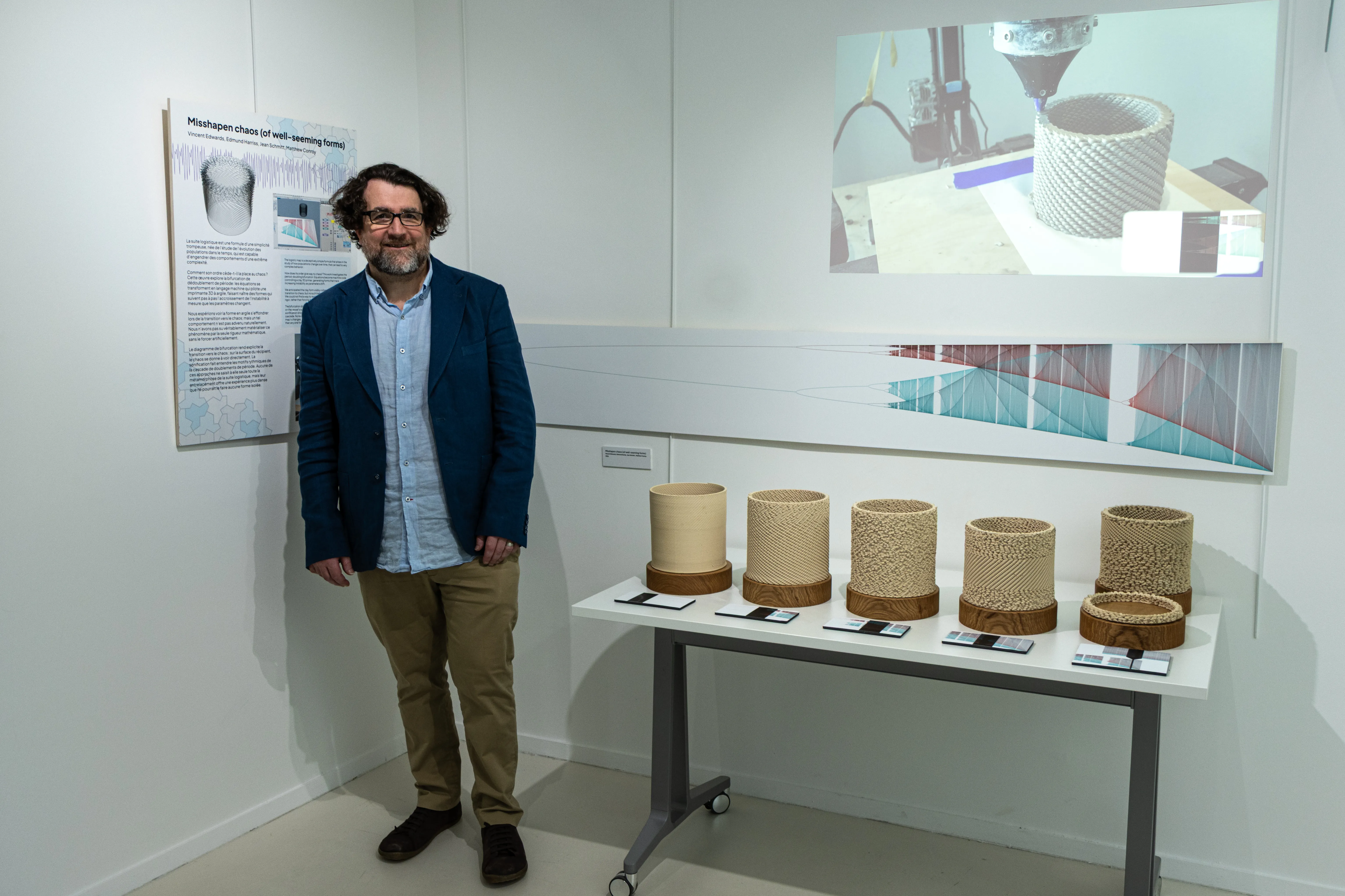 Edmund Harriss beside his ceramic vessels at the Création exhibition