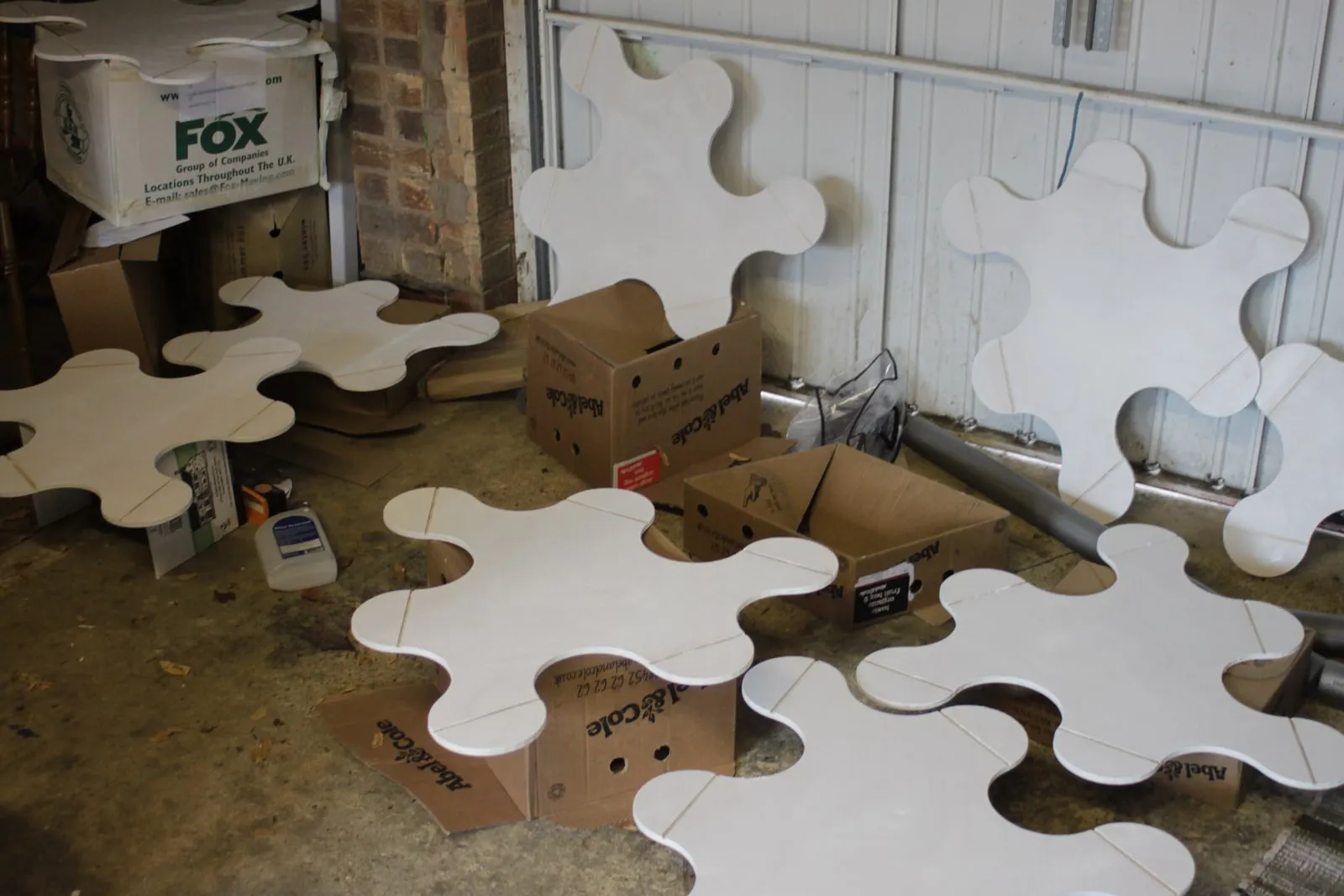Connector discs drying on the garage floor,  the circular hinges that allow each piece to pivot