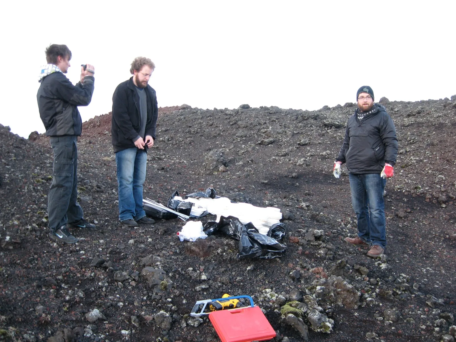 First pieces laid out on the black lava field at Eldfell, Heimaey, assembly beginning