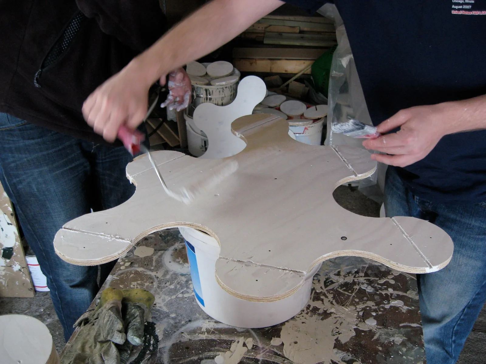 Painting and priming a piece, the connector disc recesses visible in the hinge positions